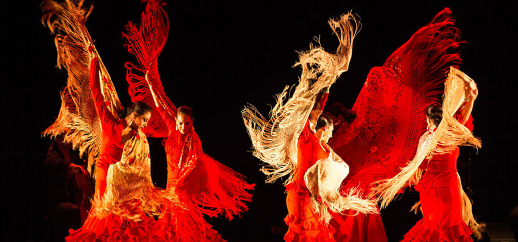 dancers in red costumes at art festival reno artown