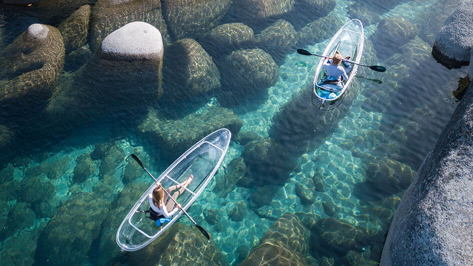 two people kayak tahoe in clear kayaks